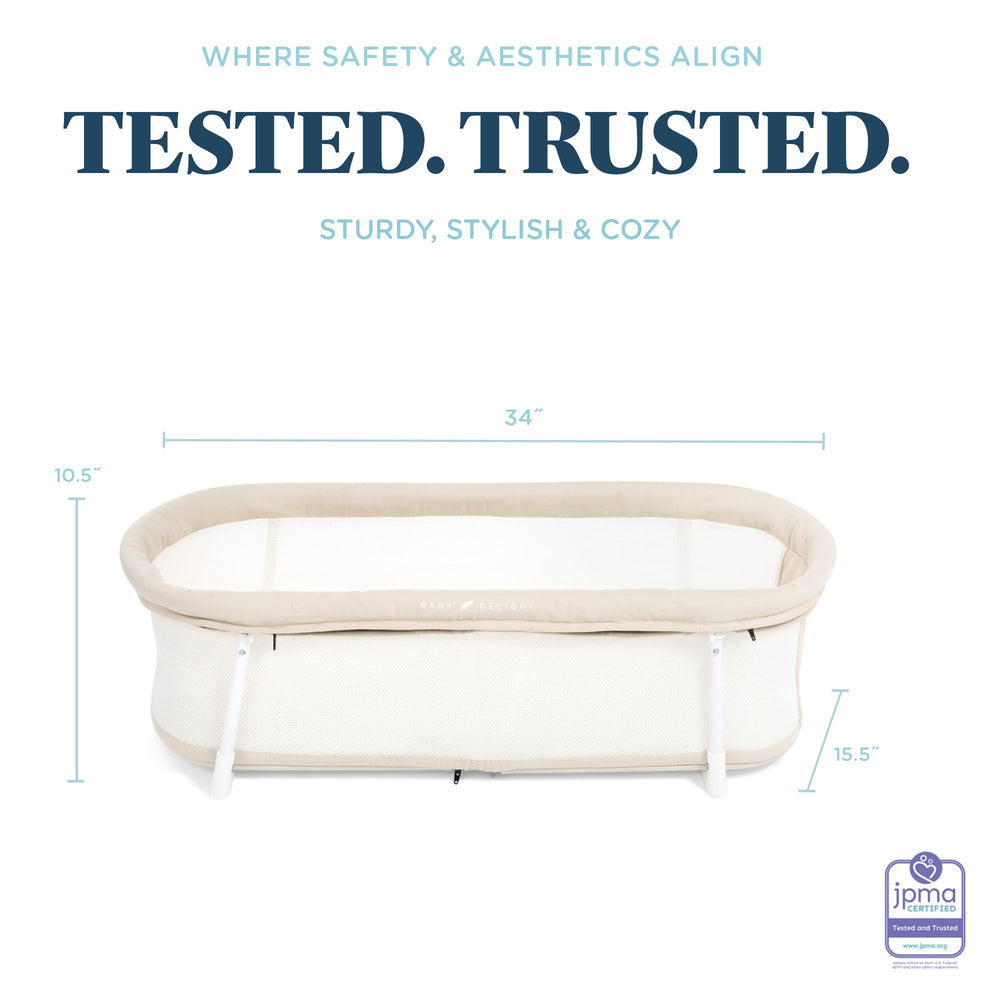 Baby Delight Snuggle Nest Bassinet features removable cover and washable components.