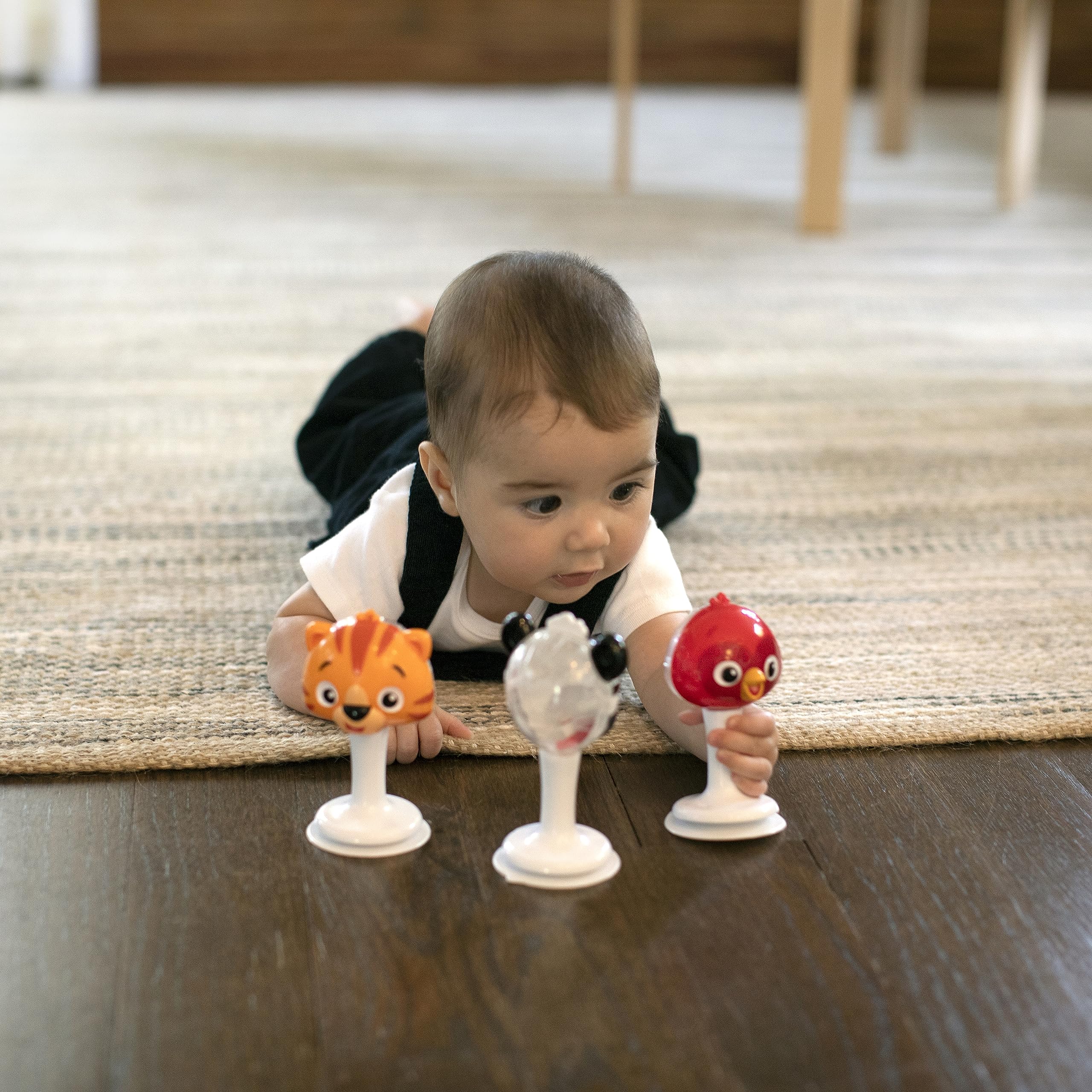 Baby Einstein suction cup high-chair toy sticks to a table for stable play.