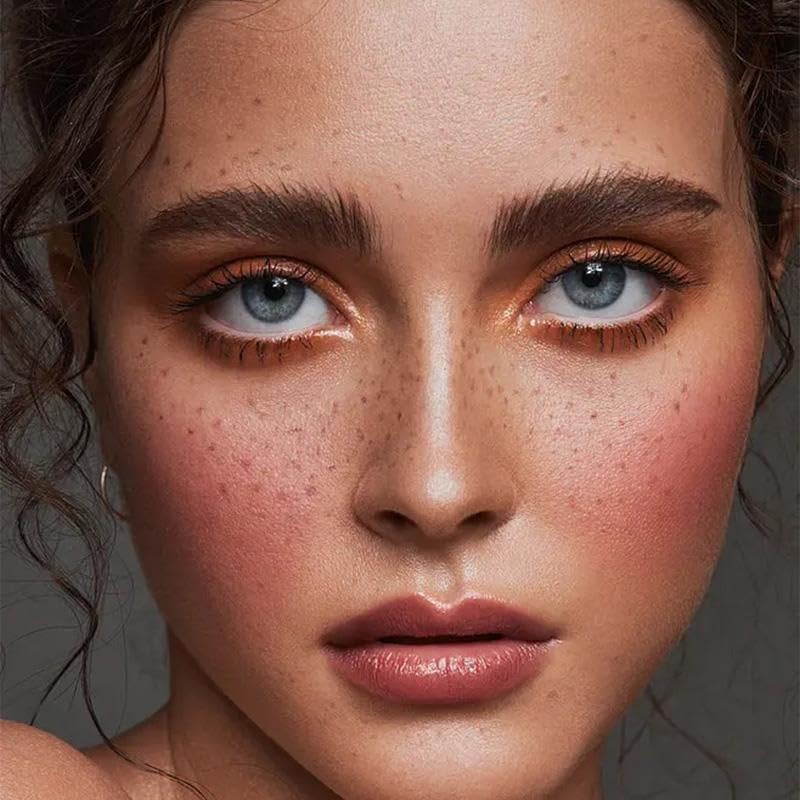 Freckles placed along nose and cheeks for sun-kissed realism.