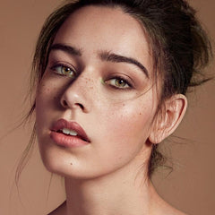 Water- and sweat-resistant wear holds freckles through humidity.