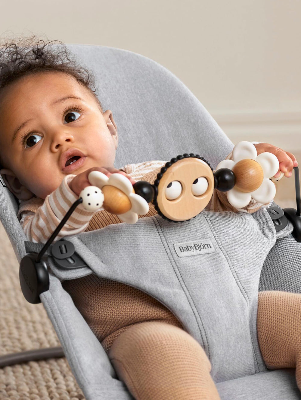 BabyBjorn Googly Eyes spins to encourage tactile exploration and attention.