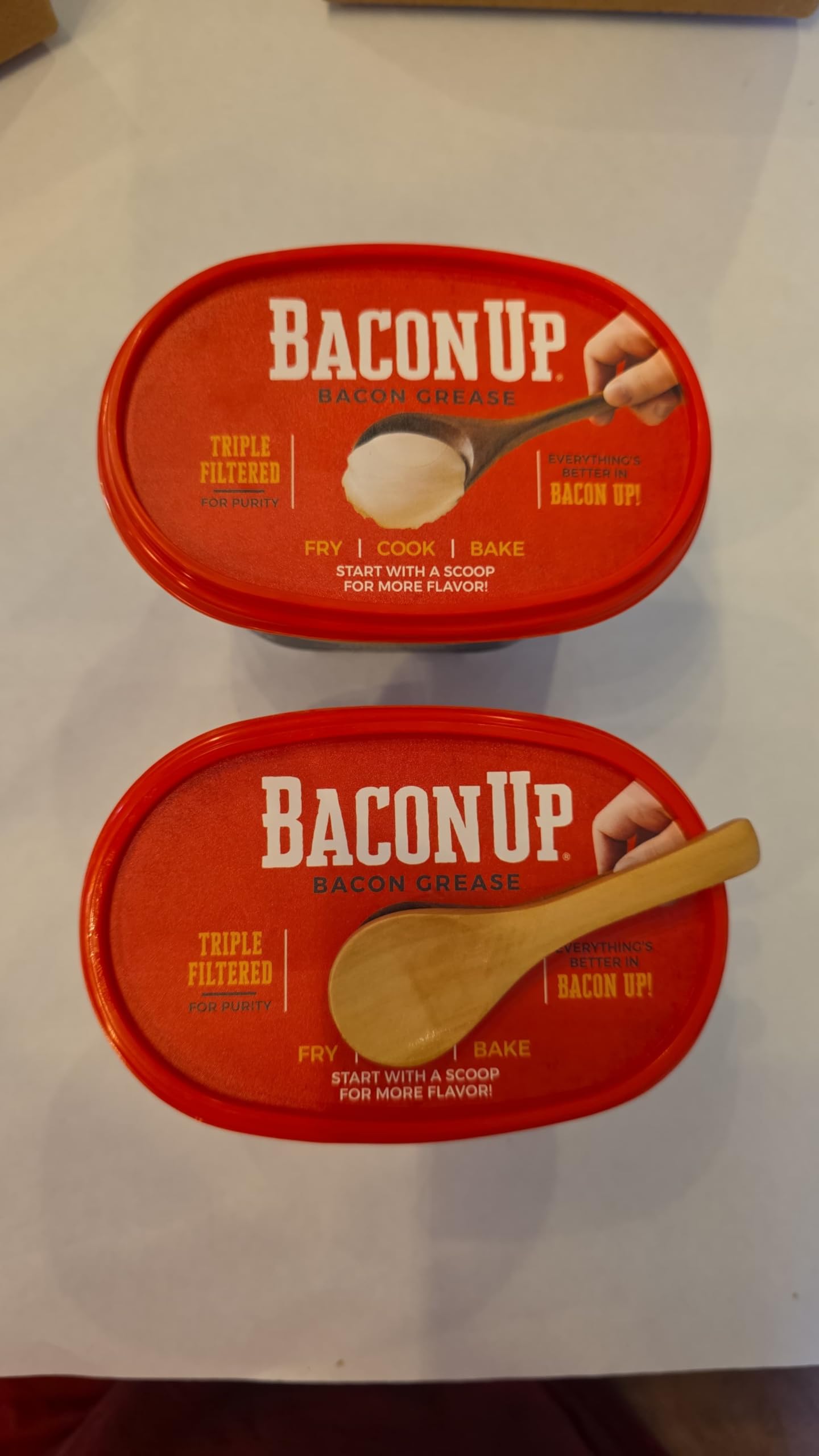 Close-up of Bacon Up grease sizzling in a pan