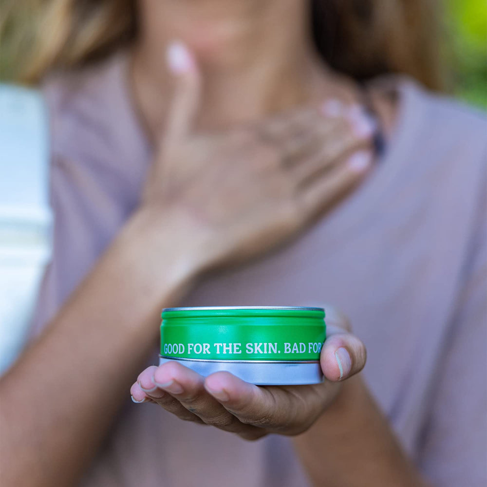 Travel-size Badger Bug Repellent Tin fits in bags and purses.