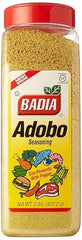 Badia Adobo seasoning being poured over ingredients for savory, smoky depth.