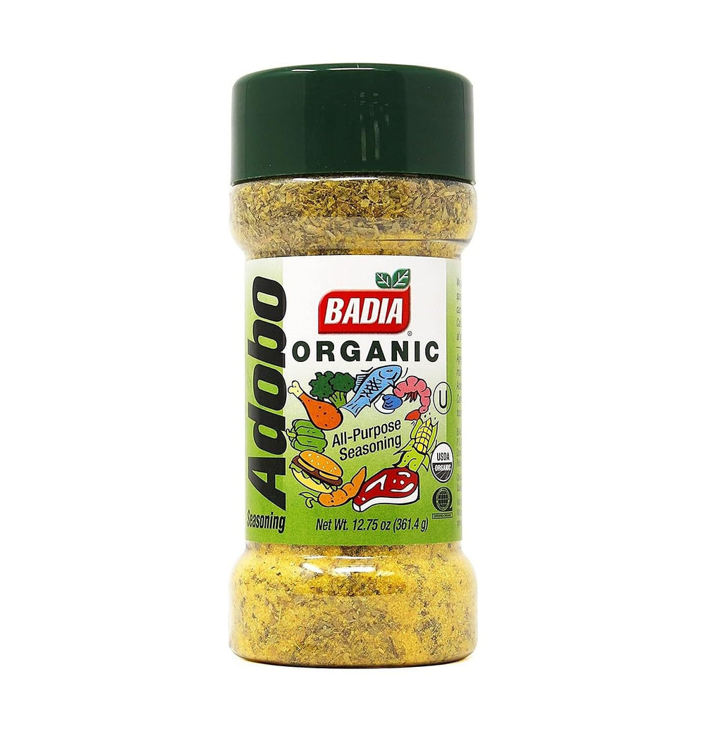 Badia Organic Adobo Seasoning bottle on kitchen counter adds versatile flavor to meats and veggies.