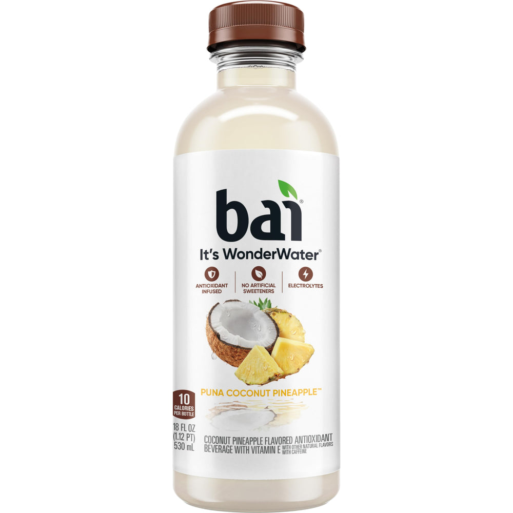 Chilled Bai Puna Coconut Pineapple beside a glass with tropical vibe
