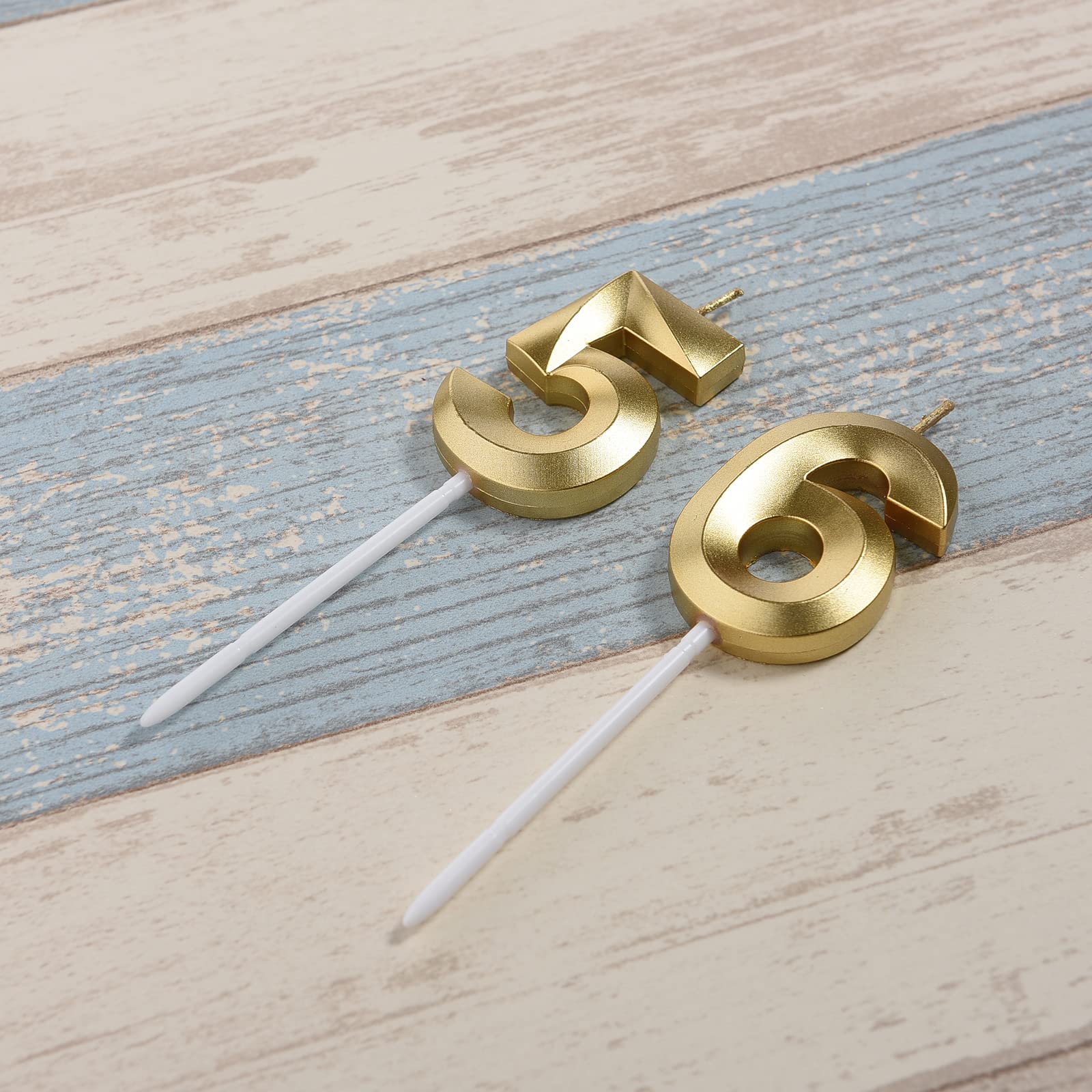 Close-up of Bailym glitter gold candles for elegant cake decoration