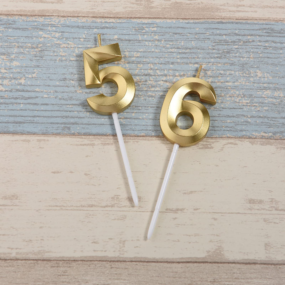 Bailym gold number 56 cake topper in close-up on celebration cake
