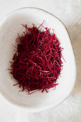 Banu Saffron saffron threads tea infusion closeup for soothing beverages.