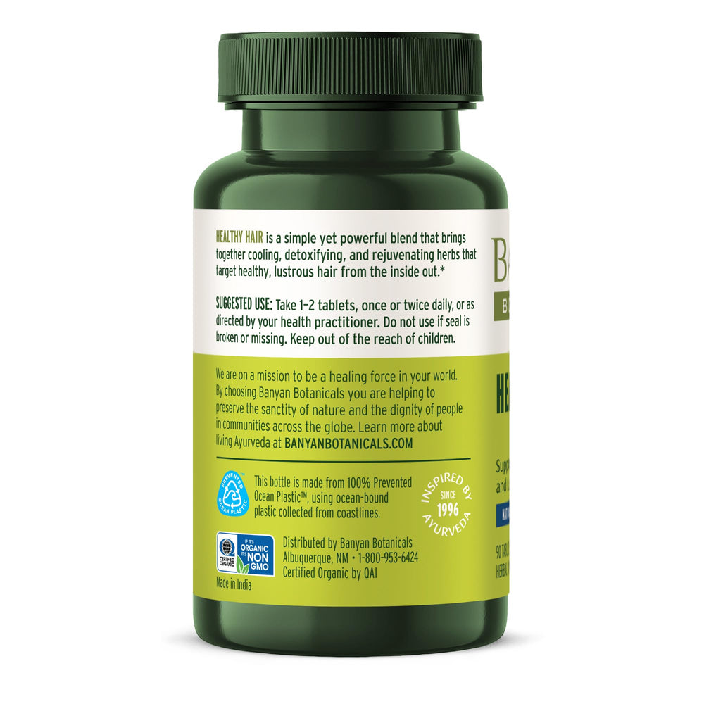 Banyan Botanicals capsules in hand for on the go.