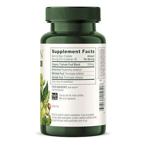 Banyan Botanicals Triphala tablets in-use cup implies routine digestion support.