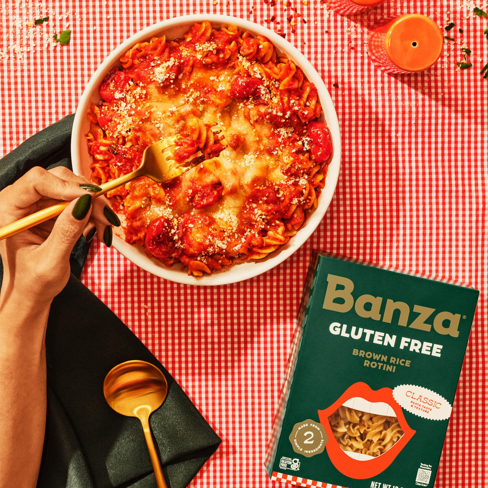 Banza Brown Rice Rotini dish-ready plated with sauce for flavor inspiration.