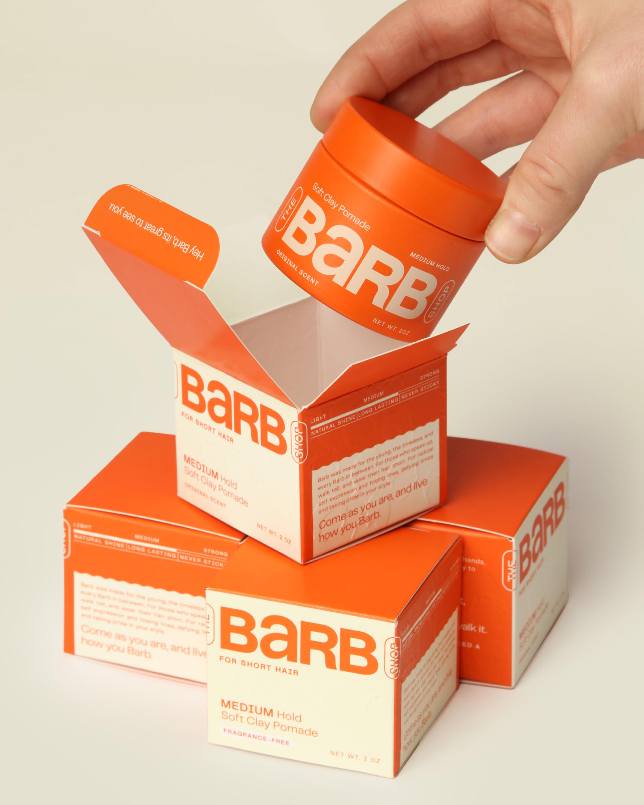 Original scent label close-up on Barb Soft Clay Pomade for brand recognition.