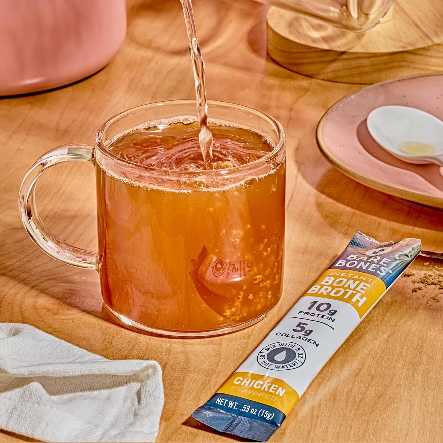 Bare Bones stick-pack dissolving in hot water demonstrates easy mix-and-go routine.