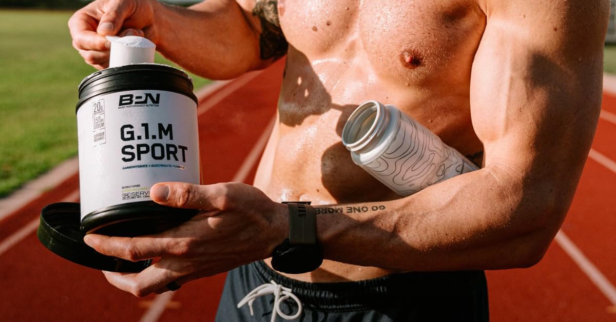 Athlete mixes Bare Performance Nutrition G1.M shake for training fueling.