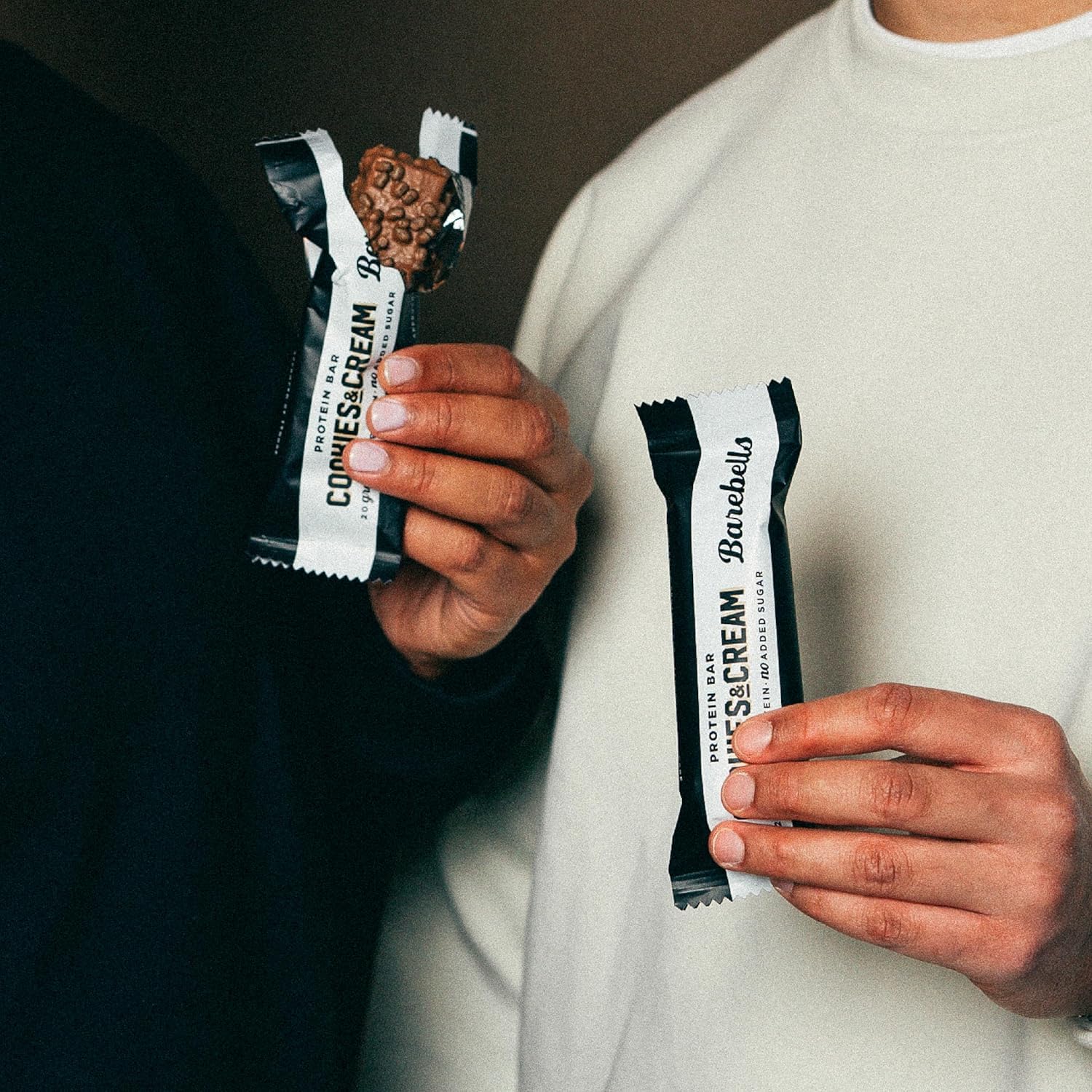 Barebells on-the-go snack held in hand