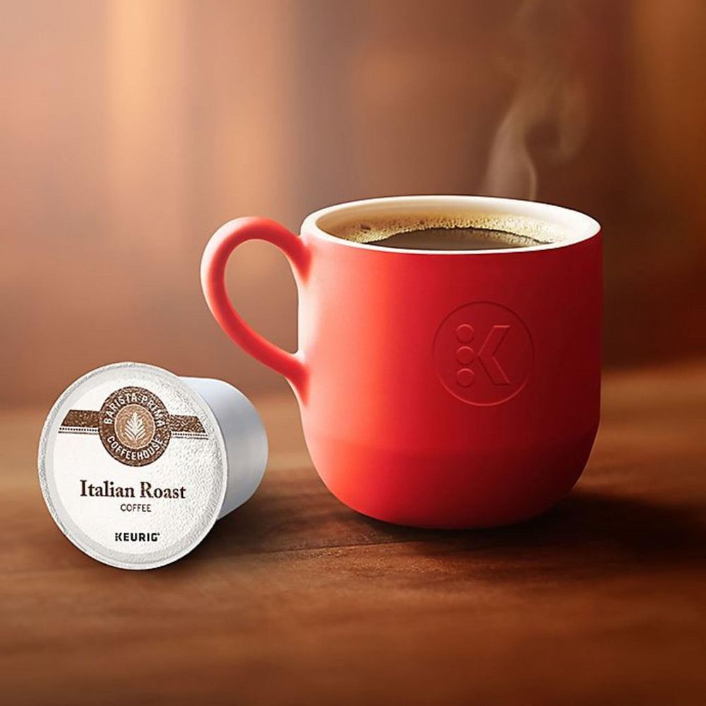 Barista Prima Italian Roast coffee beans beside pods, evoking premium roast quality and aroma.
