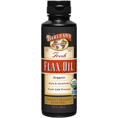 Barlean's Flaxseed Oil bottle on counter highlights cold-pressed, vegan omega-3 benefits.