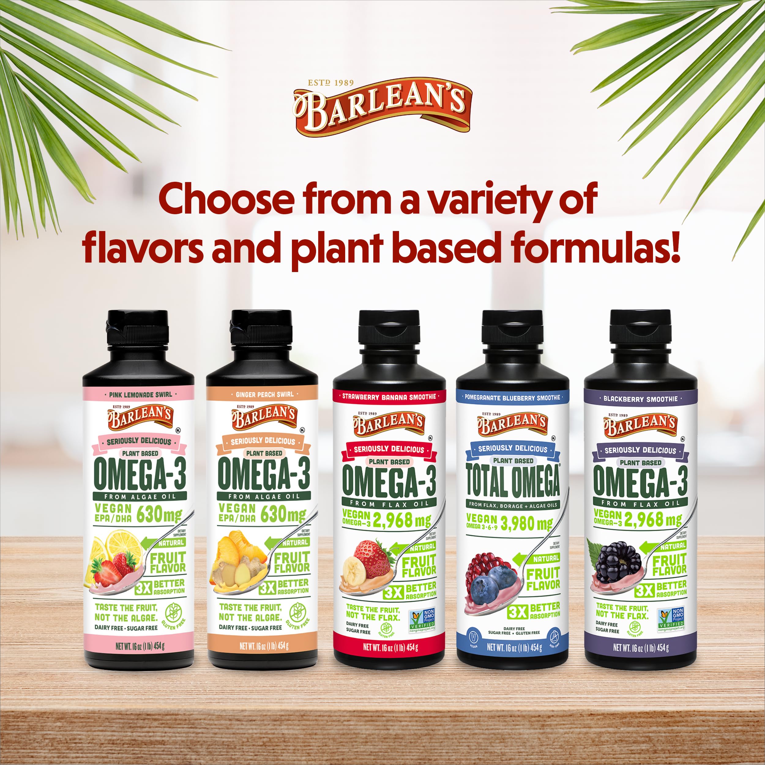 Barlean's vegan flaxseed oil bottle with label beside fruits for a smoothie