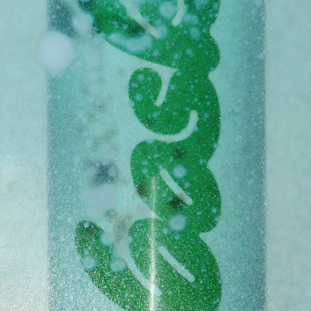Reef-safe logo on Bask sunscreen near beach scene