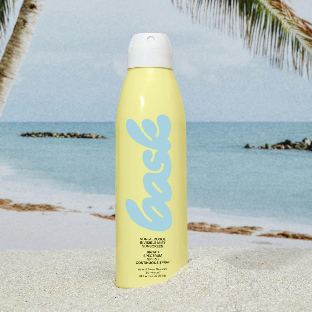 Bask SPF 30 spray mist on skin for fast absorption.