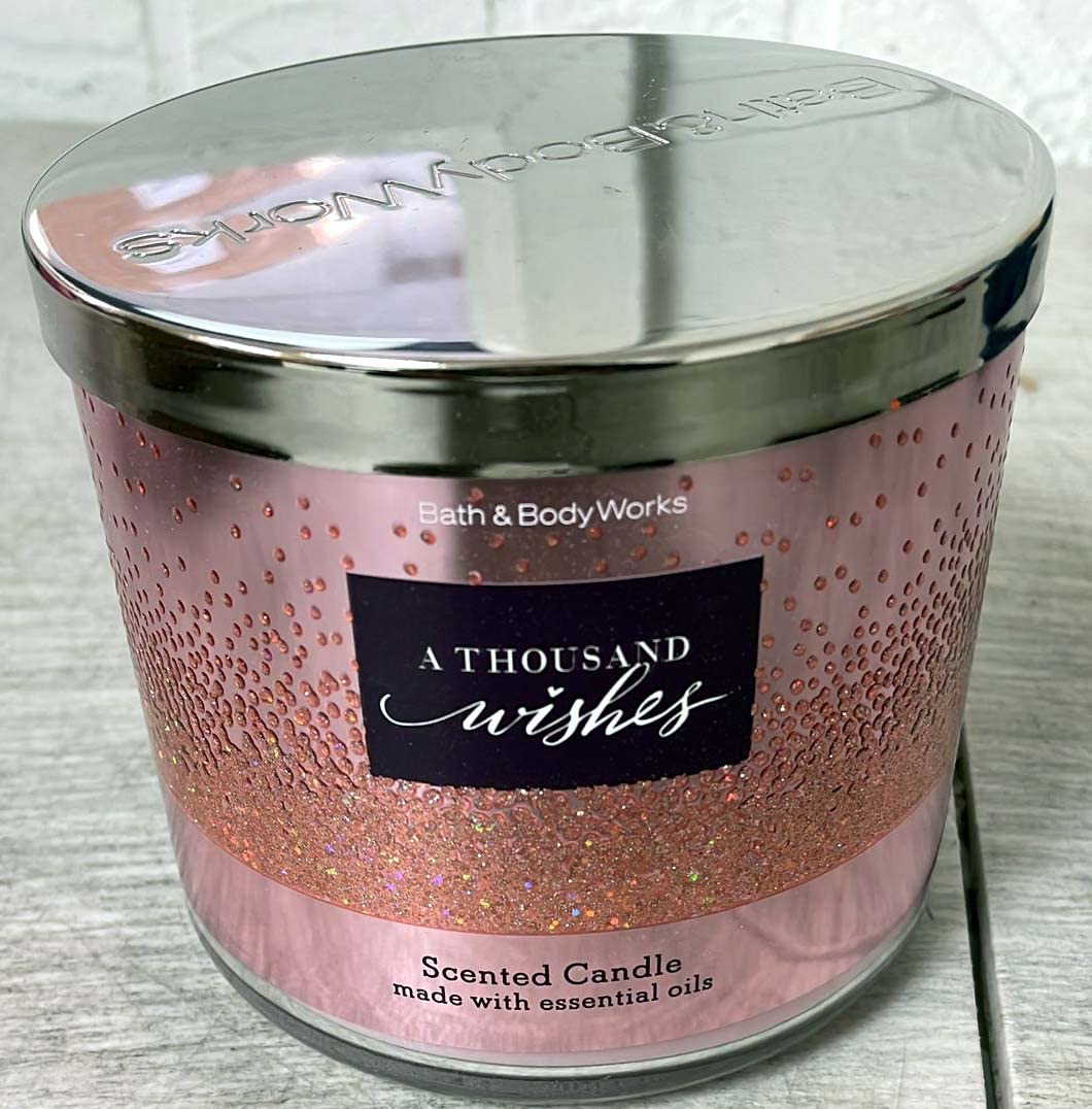 Bath & Body Works A Thousand Wishes 3-wick candle ready to fill a room with fragrance.