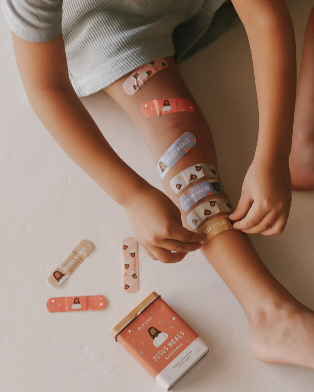 Be A Heart bandages feature five bright Jesus designs for everyday moments