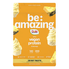 BE AMAZING vegan protein powder Dole Whip Pineapple bottle pour for a creamy protein boost.