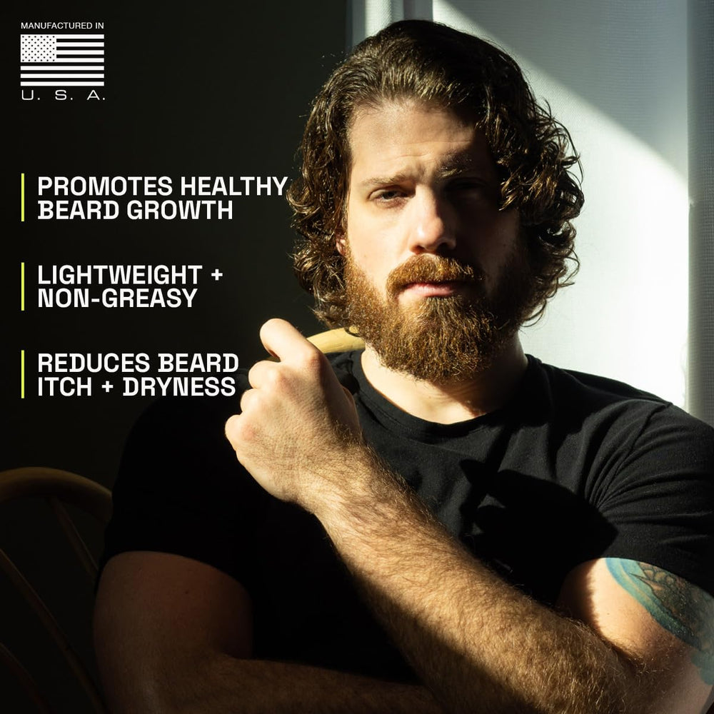 Beardbrand man applying beard oil for smoother skin and beard.