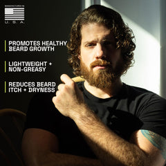 Beardbrand man applying beard oil for smoother skin and beard.