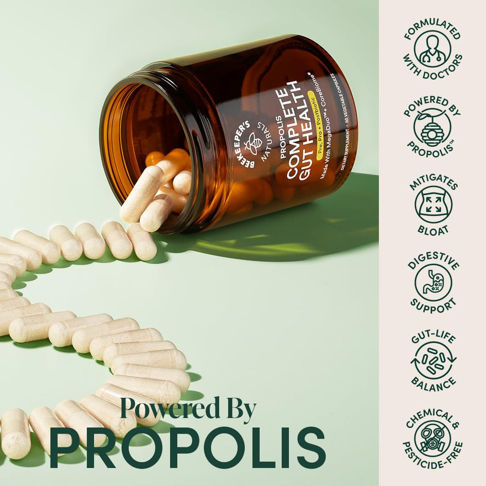 Beekeeper's Naturals Complete Gut Health capsules pour into a glass for daily routine.