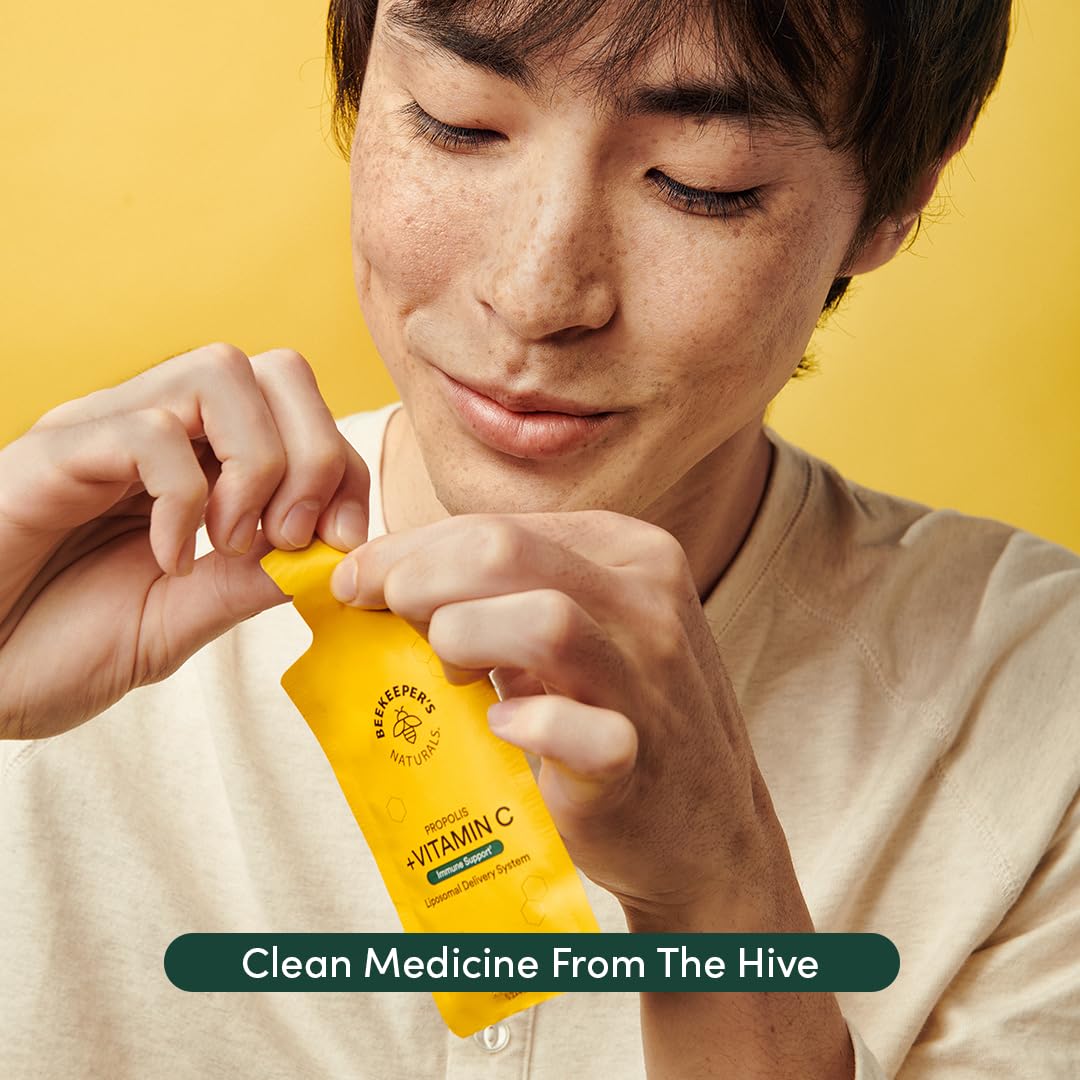Squeeze-use image demonstrating direct mouth application of Beekeeper's Naturals product