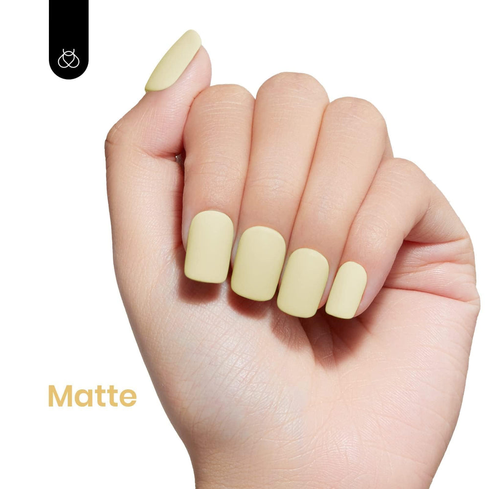 Beetles Pastel Yellow nails with a glossy spring finish