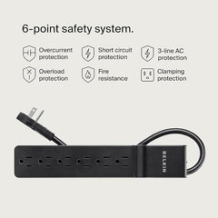 Belkin surge protector 600 Joules guarding office equipment from power spikes.