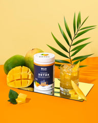 Bella All Natural Extreme Detox Mango powder scoop highlights easy measurement for on-the-go