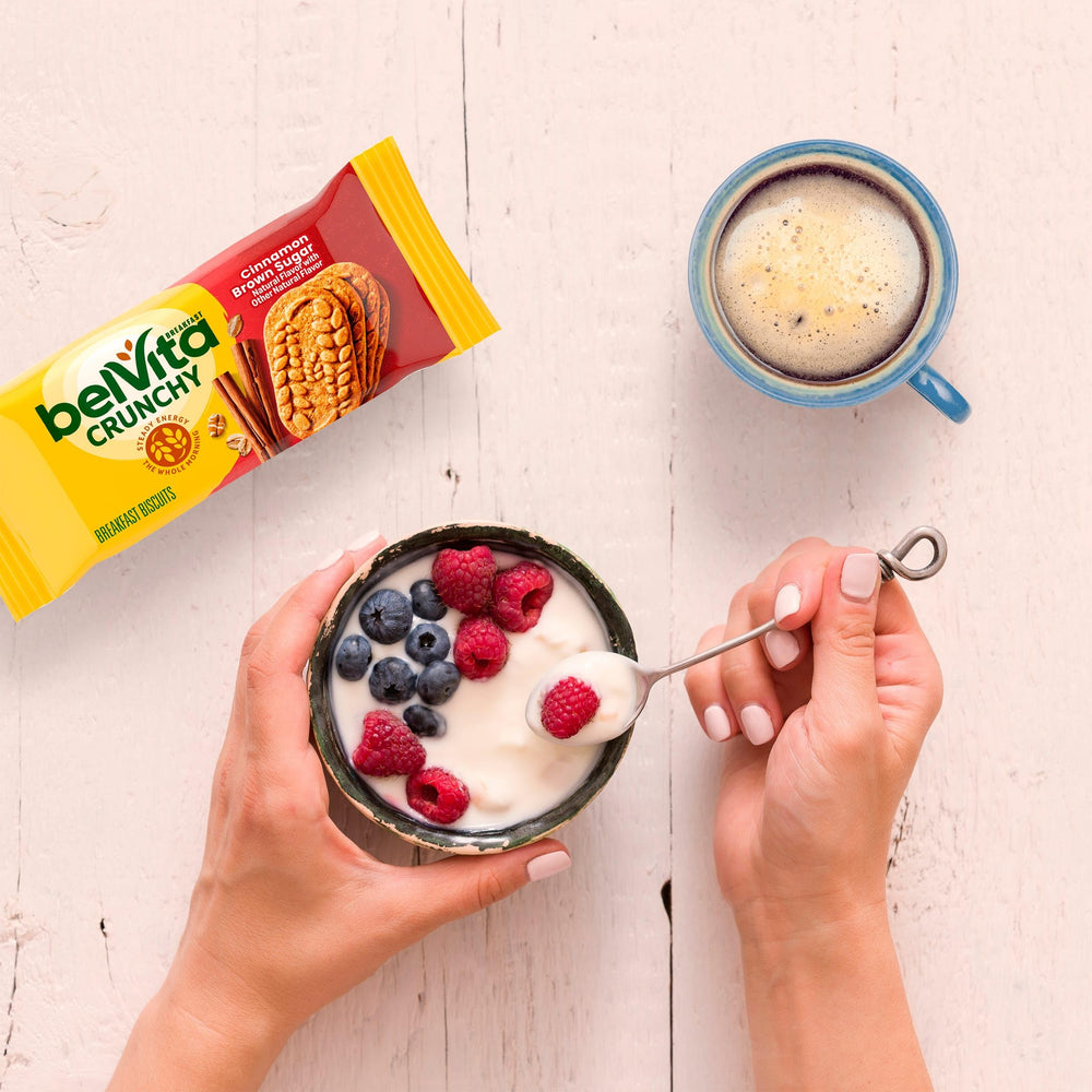 Belvita biscuits with yogurt and fruit offer a balanced start.