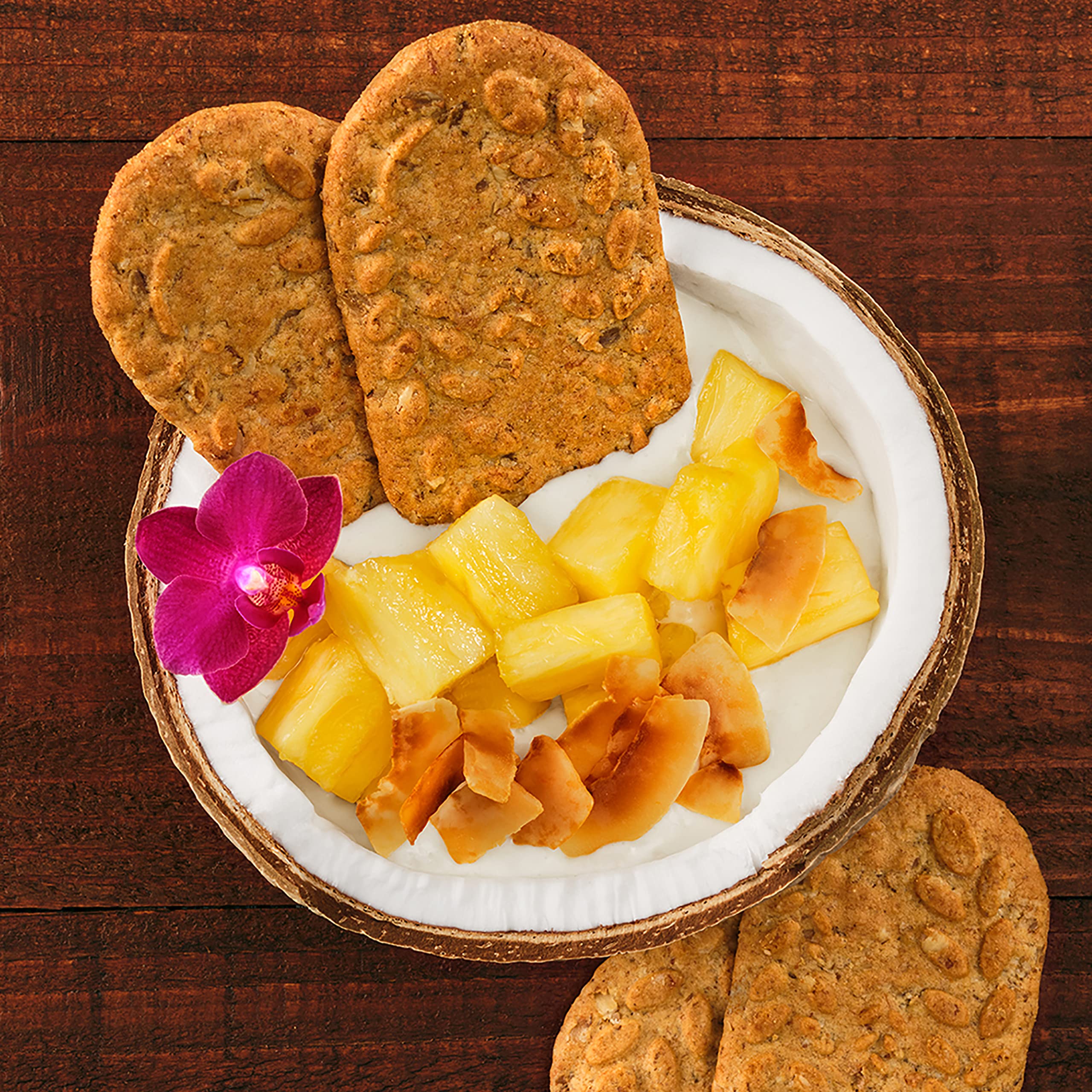 Belvita Toasted Coconut biscuits product shot emphasizing no artificial colors.