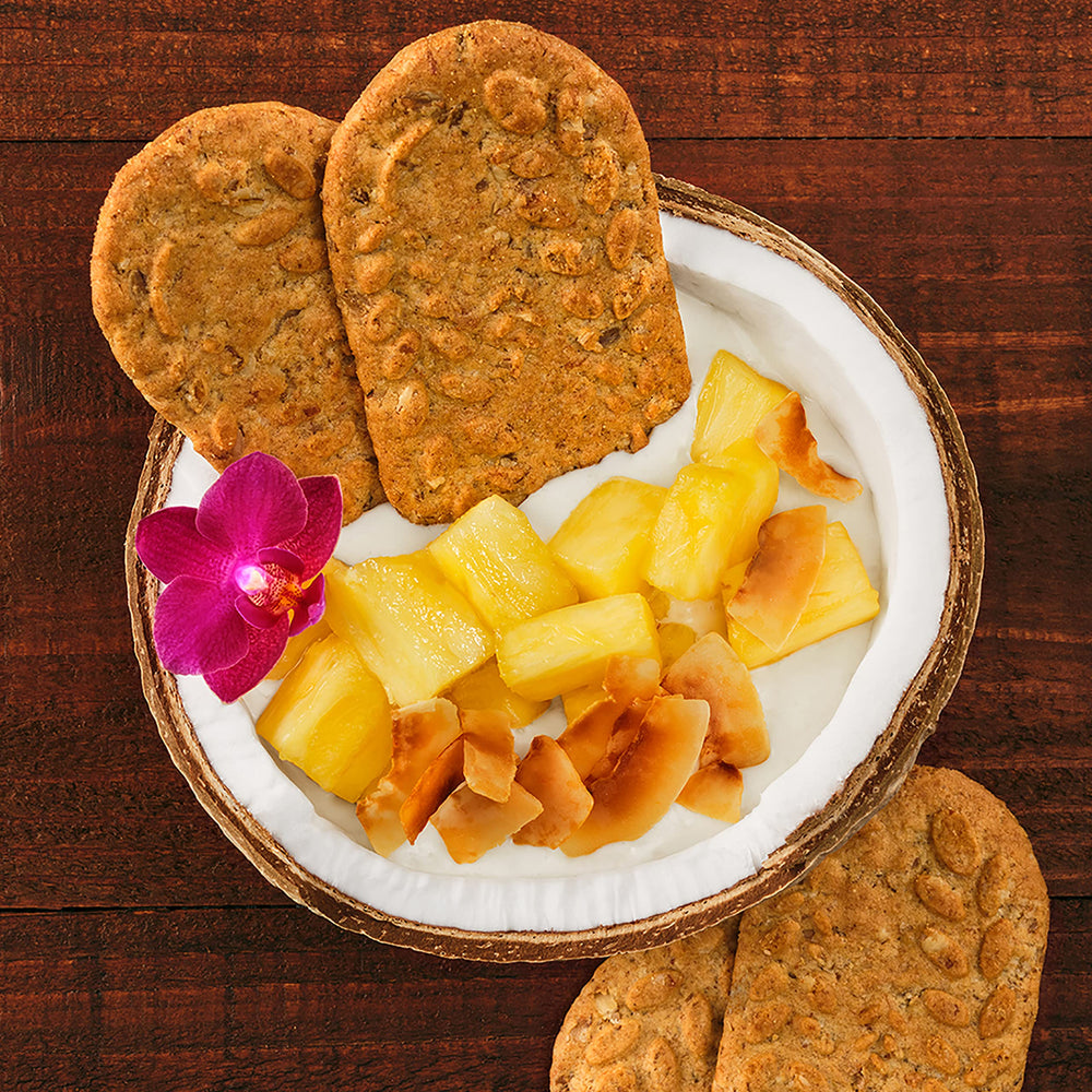 Belvita Toasted Coconut biscuits product shot emphasizing no artificial colors.