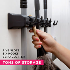 Berry Ave mop and broom holder installed in a closet demonstrates clutter-free storage