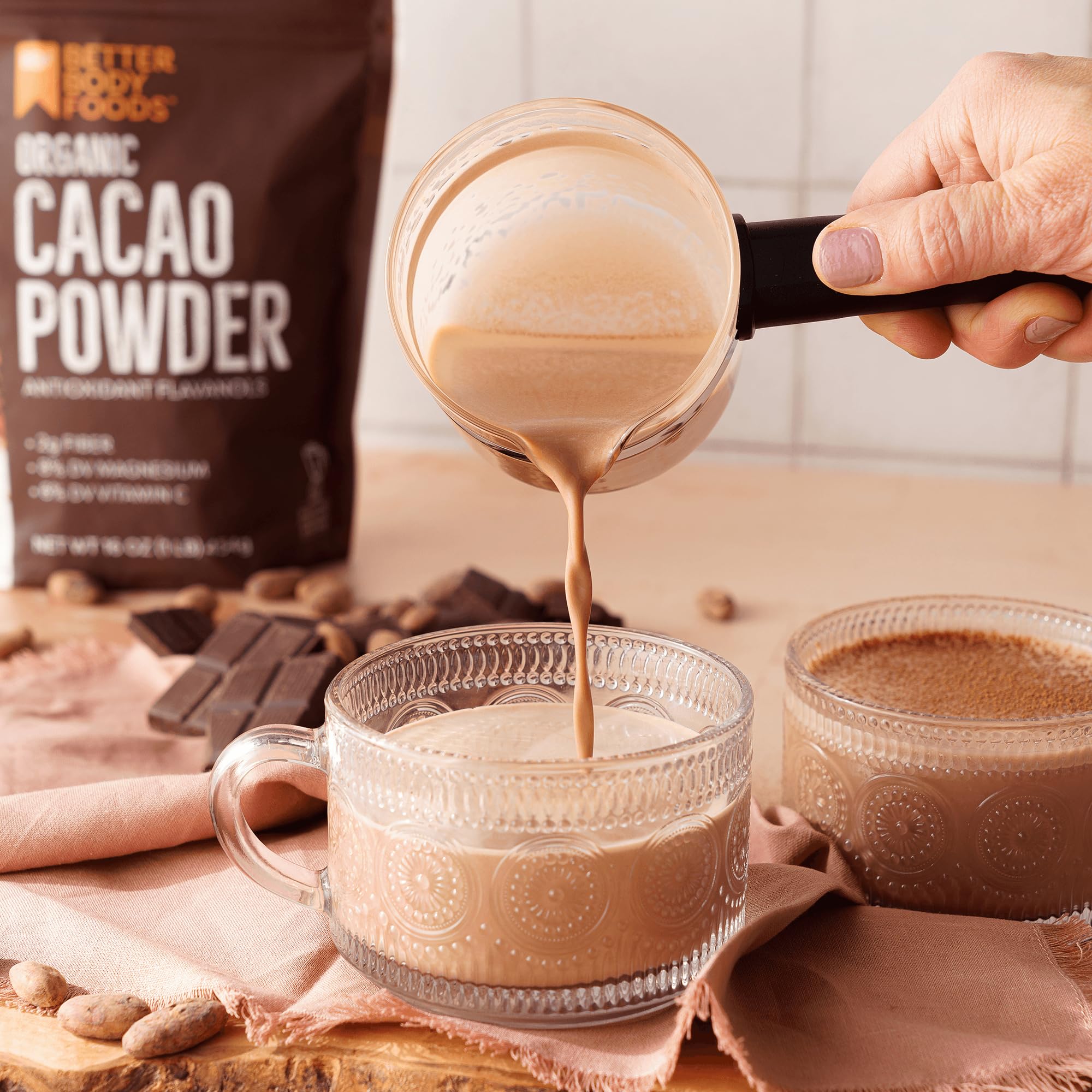 Cacao powder being added to baking batter for rich chocolate flavor