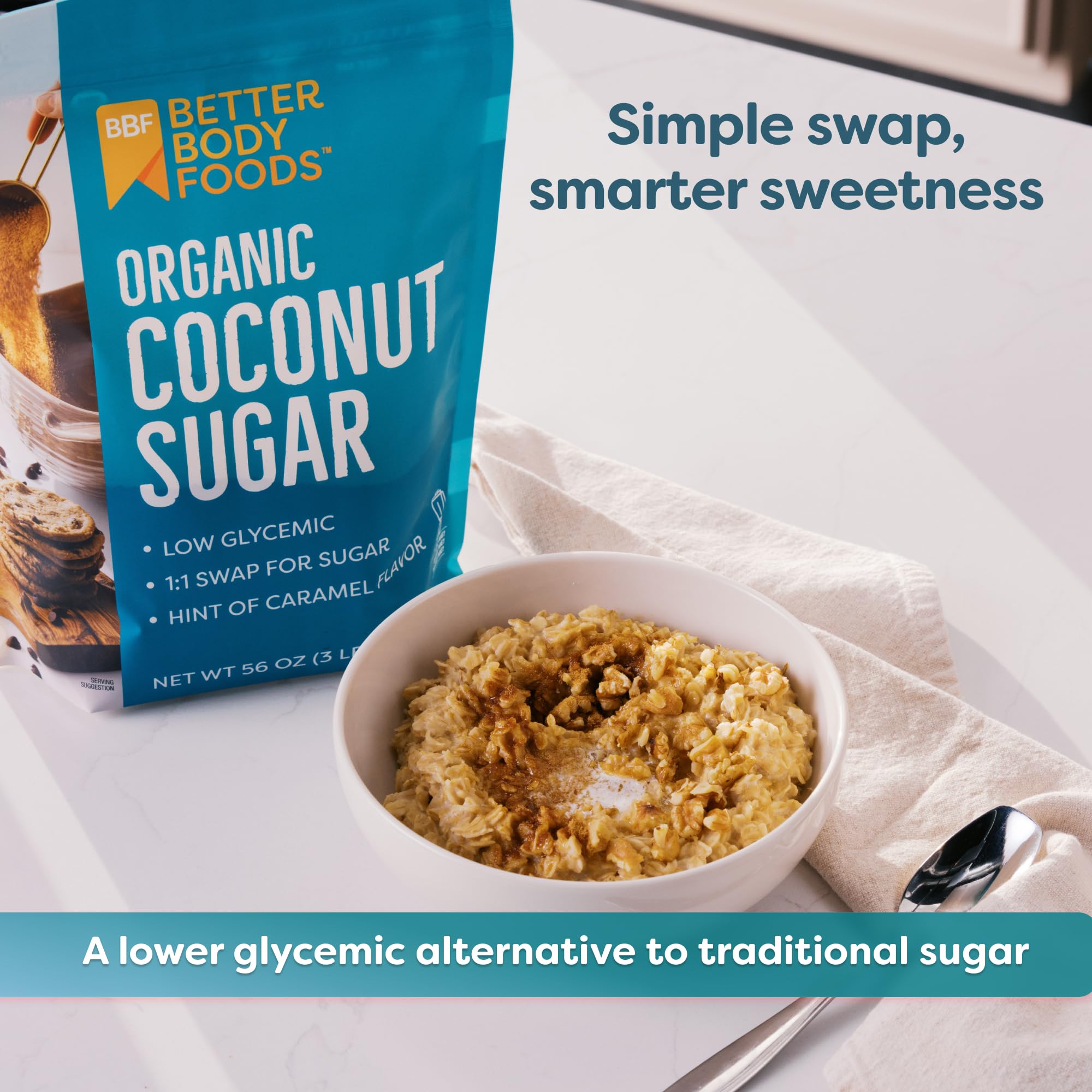 BetterBody Foods measuring scoop over organic coconut sugar ready for a spoonful in recipes.