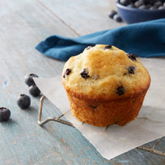 Betty Crocker Blueberry Muffin Mix oven-baking scene with golden muffins.