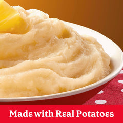 Adding hot water to Betty Crocker mashed potatoes for preparation