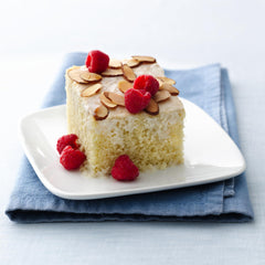 Betty Crocker vanilla cake cooling on a rack after baking.
