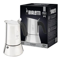 Bialetti Venus induction coffee maker on stove showcasing stainless steel finish and Italian craftsmanship.