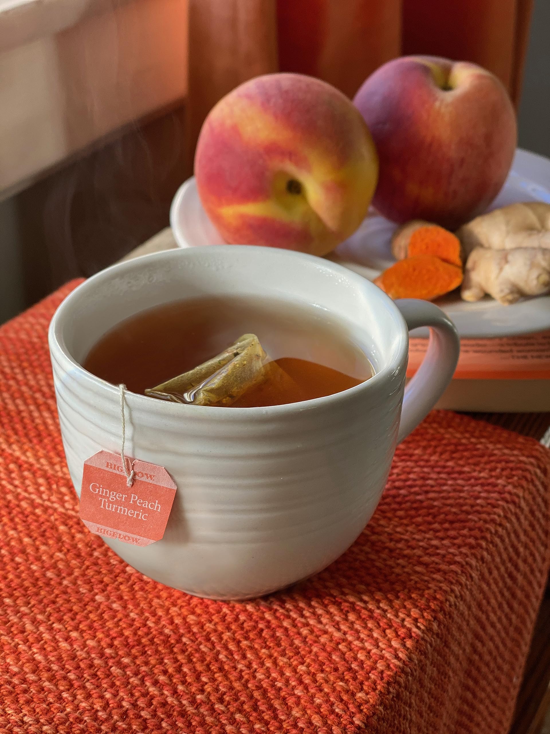 Bigelow Ginger Peach Turmeric tea 18-count pack for versatile hot or iced tea.