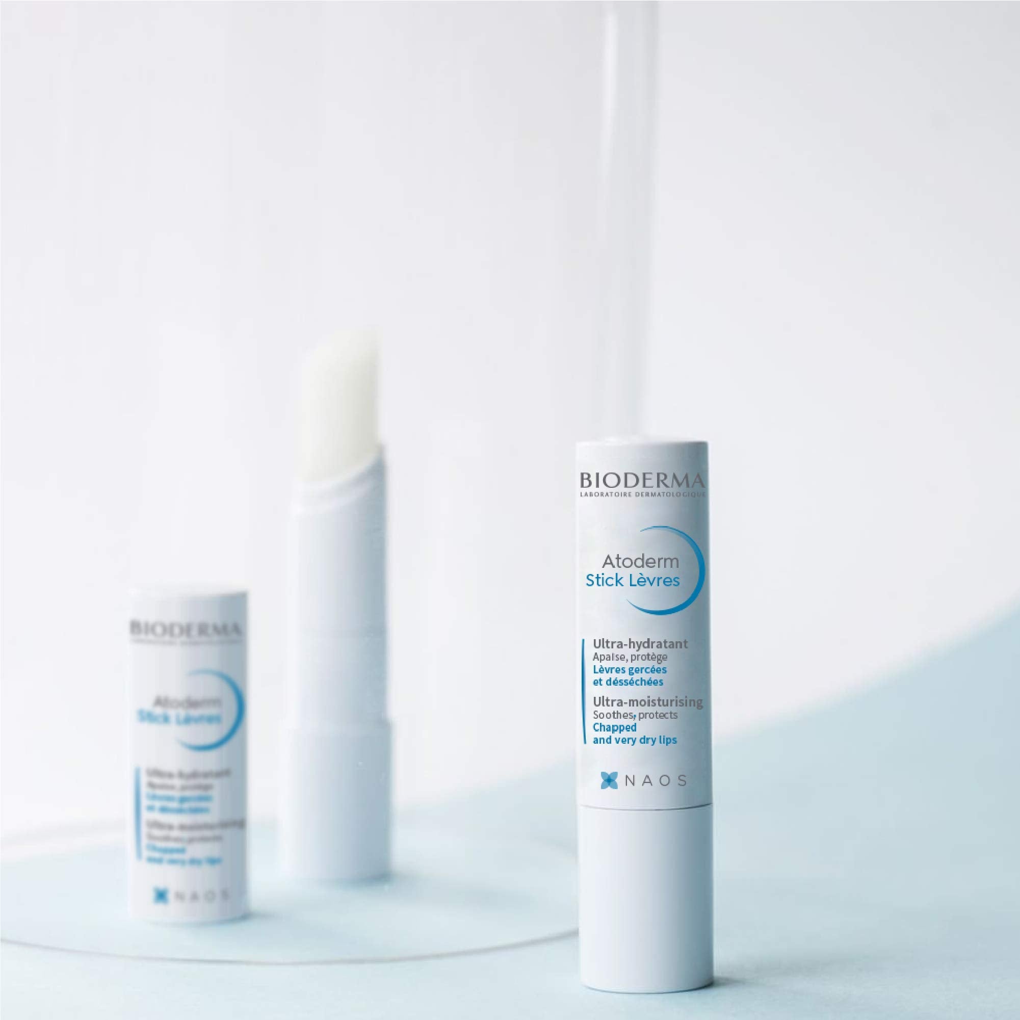 Bioderma Atoderm Lip Stick hydration droplets indicating moisture boost