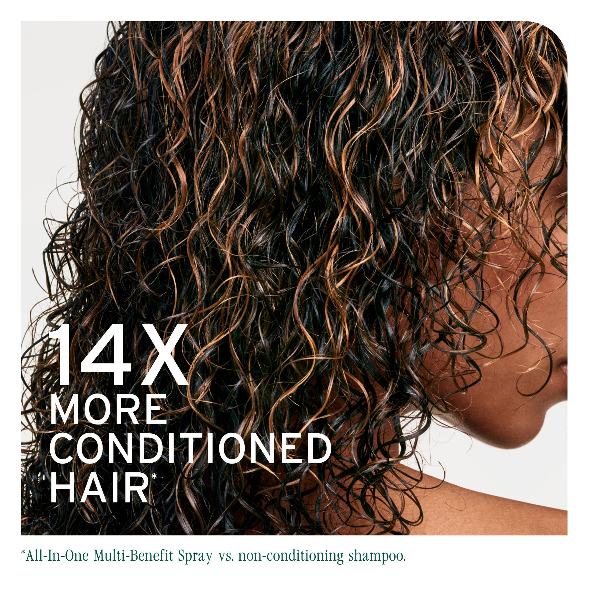 Biolage All-In-One spray misting on hair for shine and frizz control.