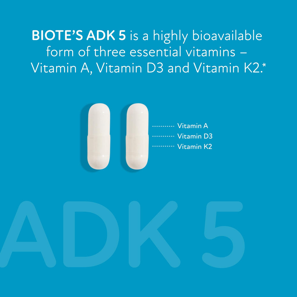 Biote ADK 5 capsules in hand for daily supplementation