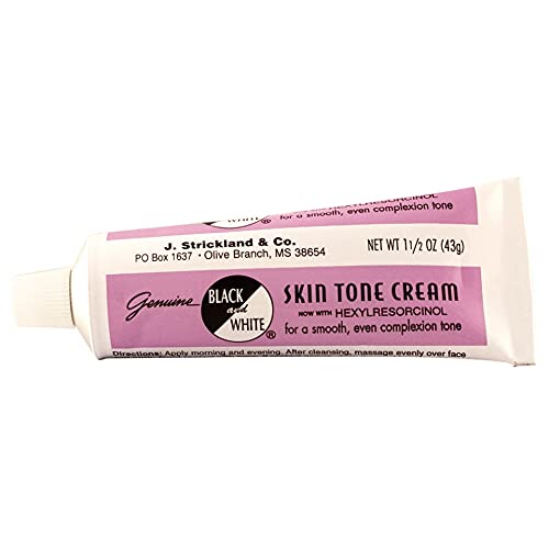 Black and White color correction cream texture swatch on skin, illustrating a natural finish.